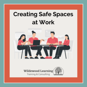 Illustration of four people sitting at a table, talking and working on laptops. Text reads Creating Safe Spaces at Work. Wildewood Learning Training & Consulting logo is at the bottom.